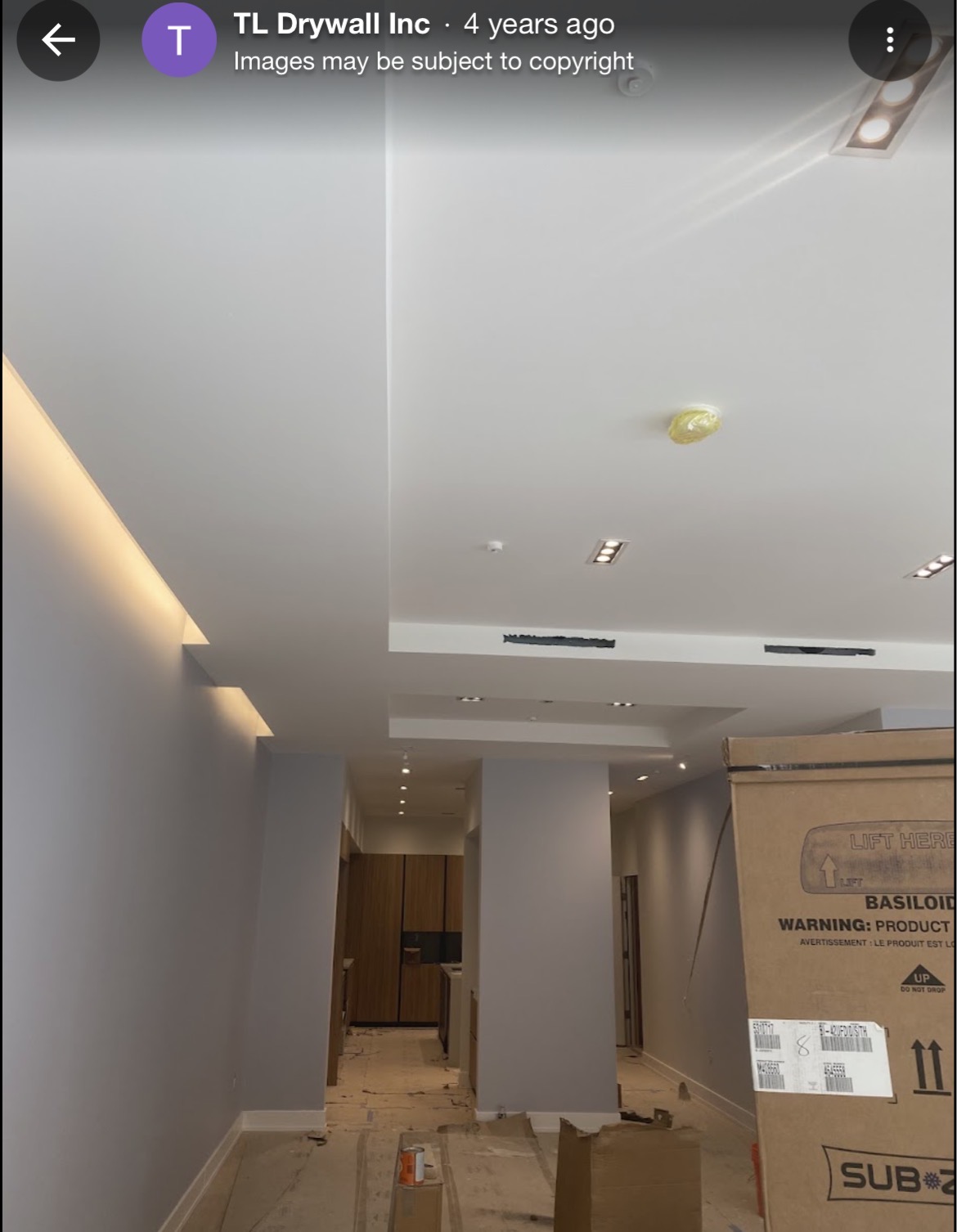 Finished interior with custom ceiling and recessed lighting