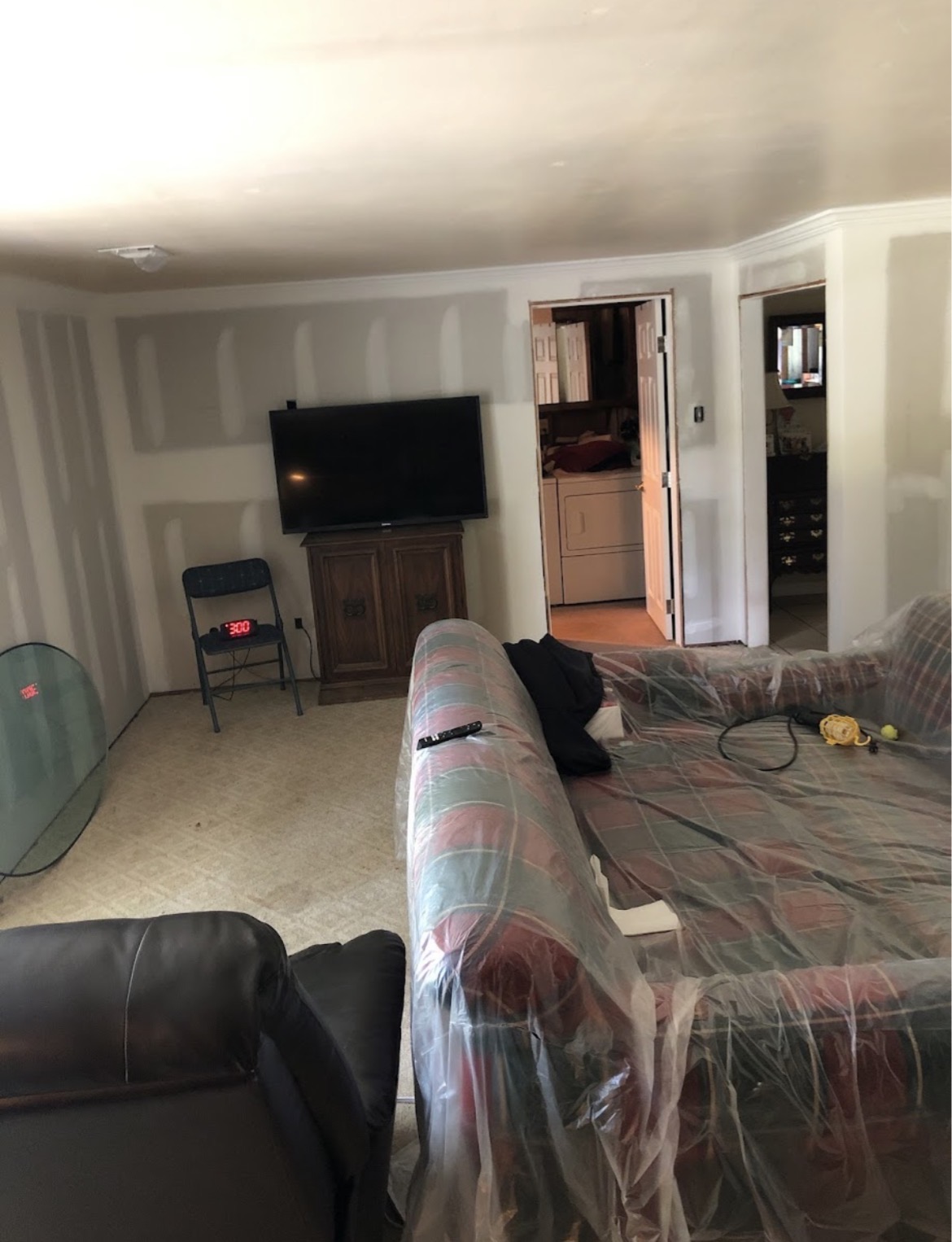Living room remodel with new drywall and crown molding