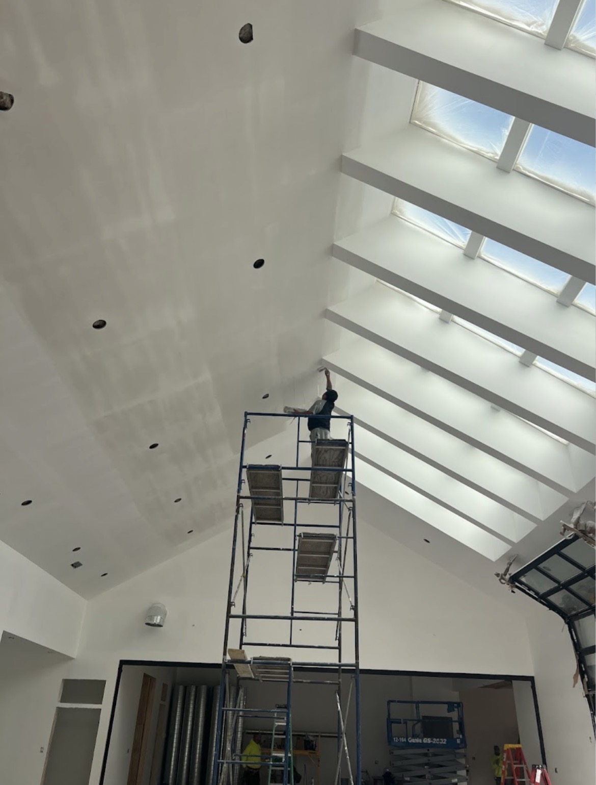 Vaulted ceiling drywall finishing with skylights